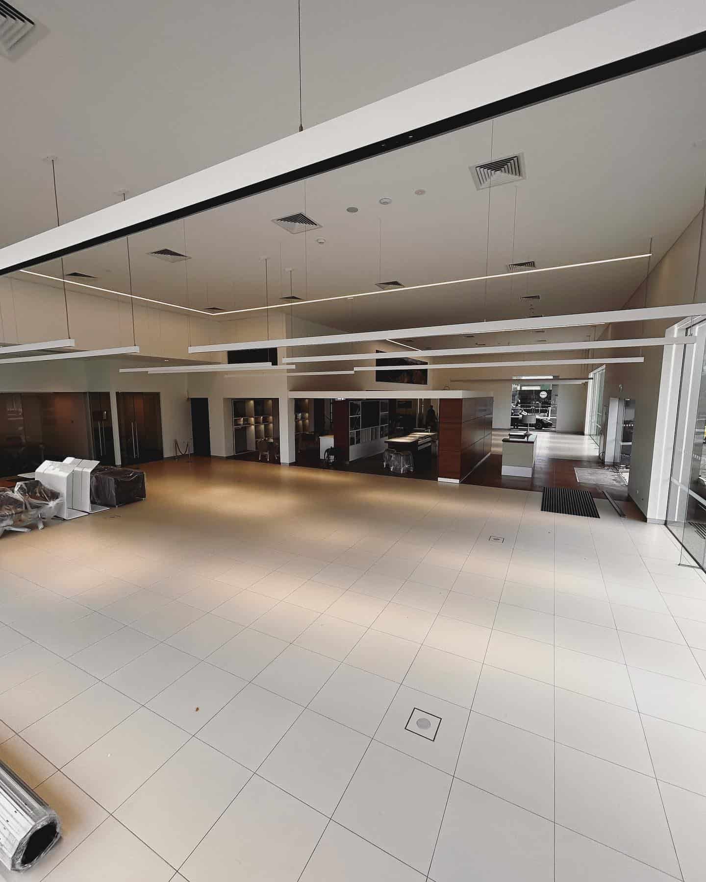A Large Room With a Lot of Windows and Lights on the Ceiling — ASpect Wall & Floor Tiling in Tuncurry, NSW