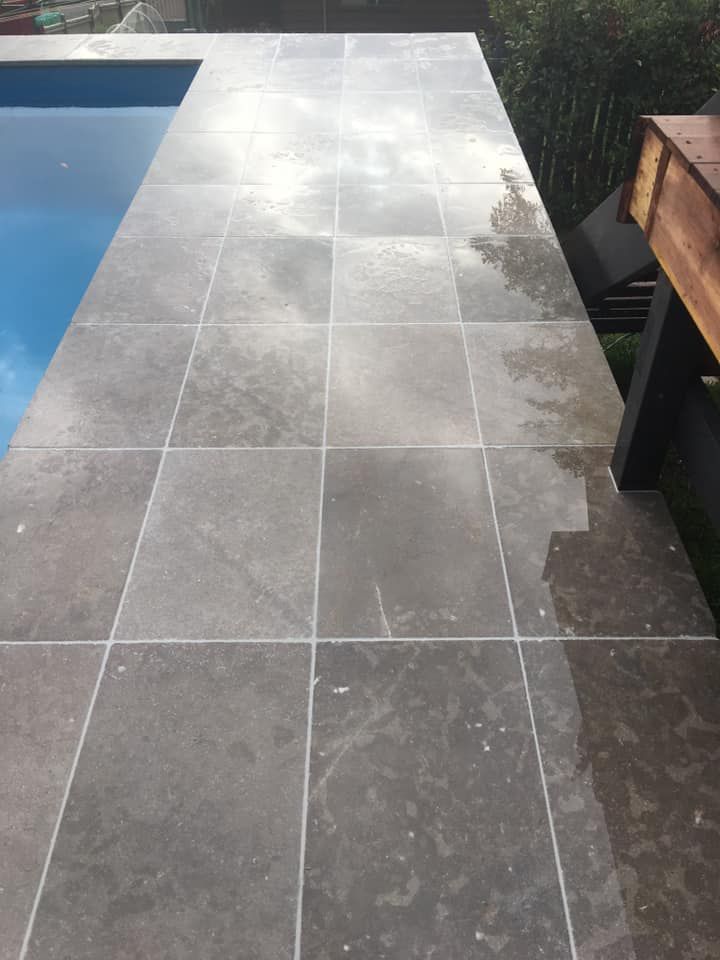 A Tiled Walkway Leading to a Swimming Pool — ASpect Wall & Floor Tiling in Tuncurry, NSW