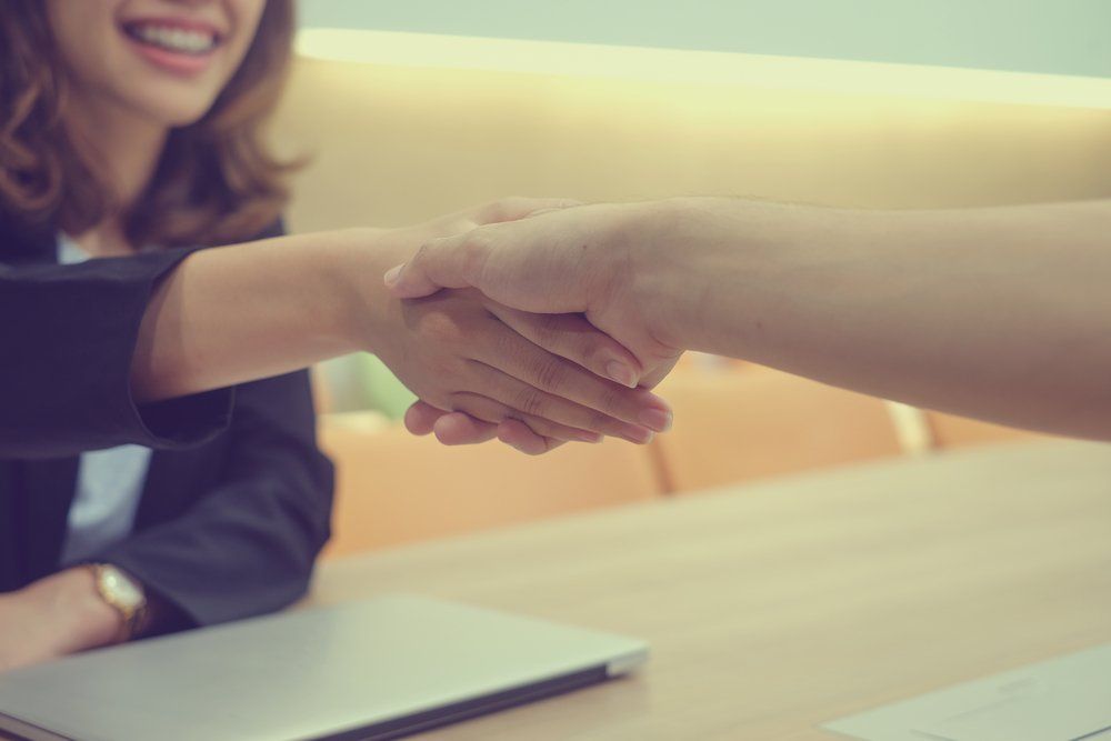 Business Agreement Hand Shake — Loans in Warners Bay, NSW