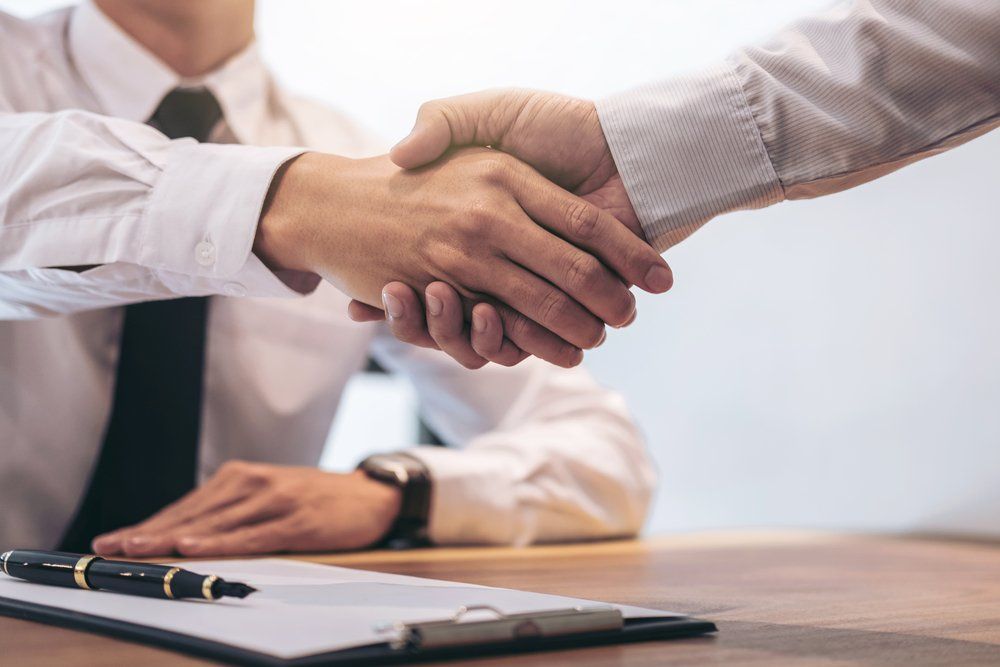 Agent and Customer Shaking Hands — Loans in Warners Bay, NSW