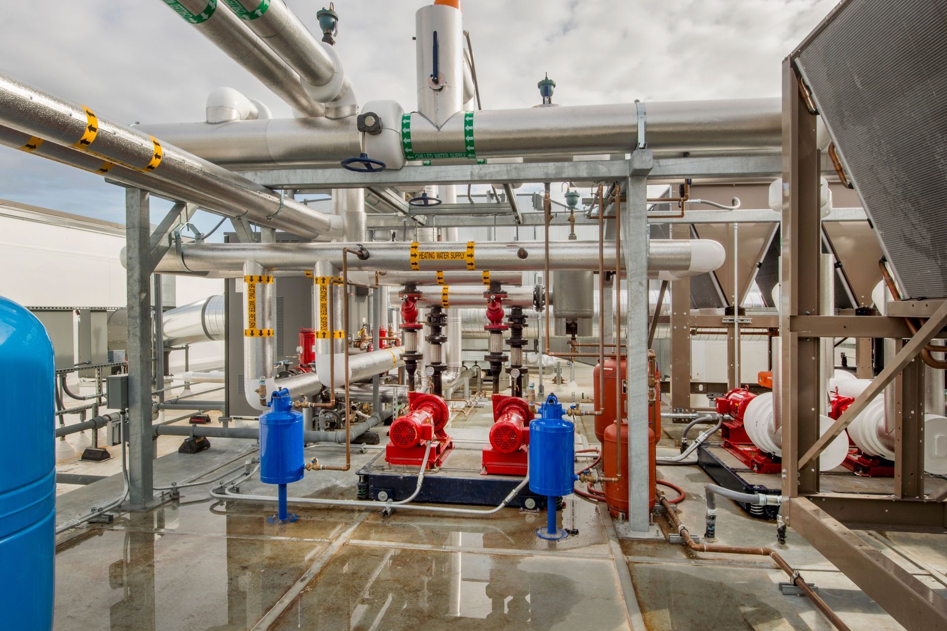 A large industrial area with lots of pipes and pumps
