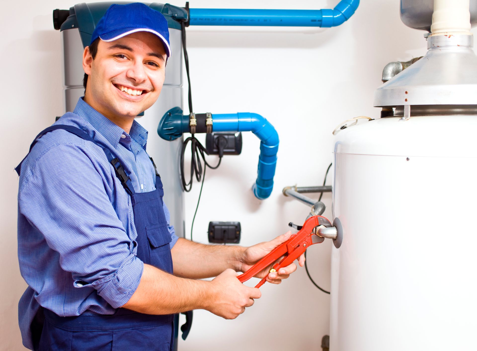 Plumber fixing water heater