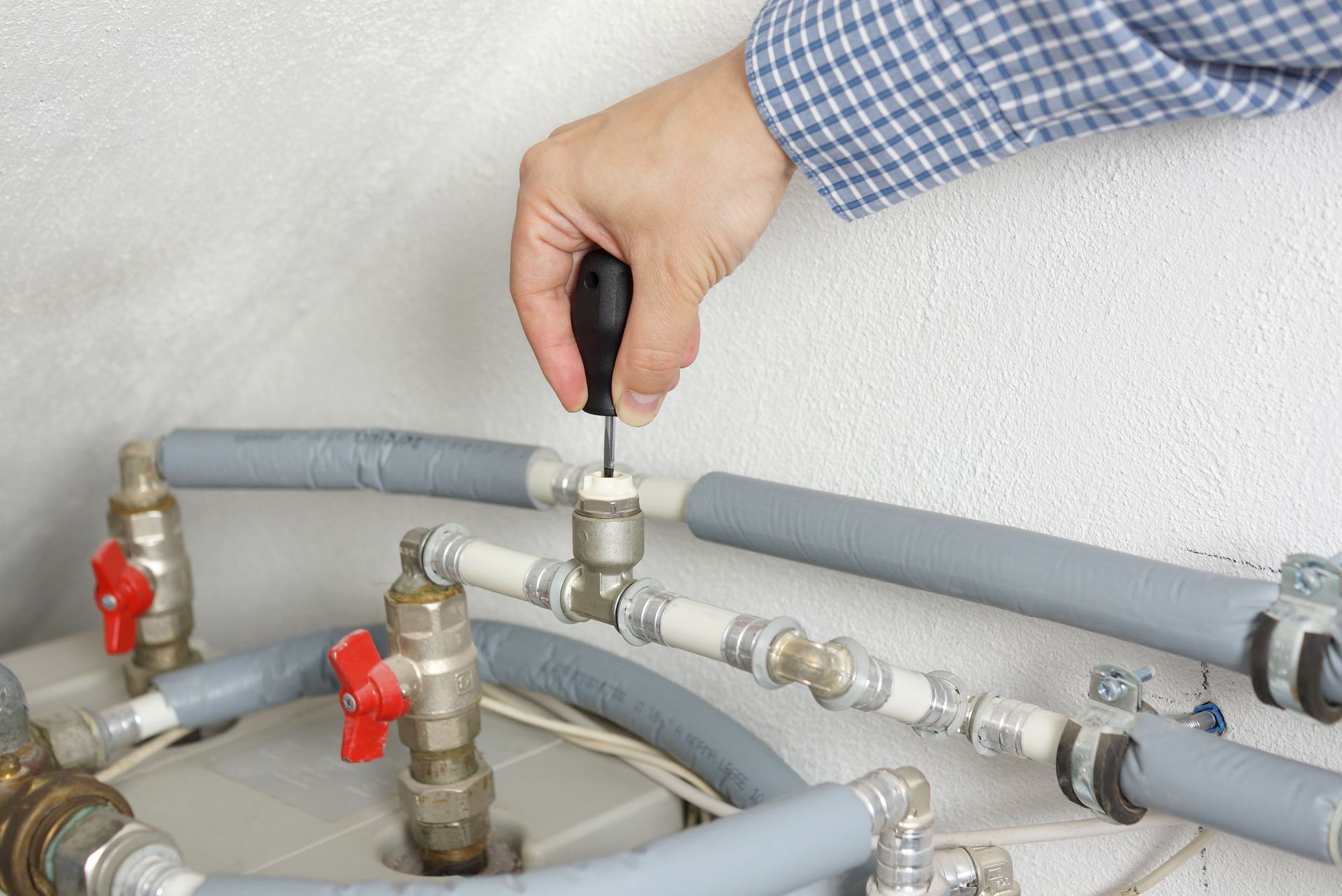 Technician fixing pipes