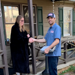 Worker shaking hands with woman