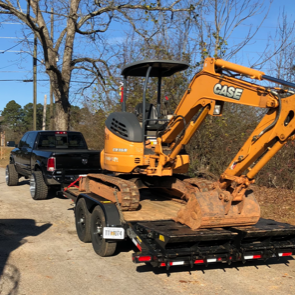 Case excavator on trailer.