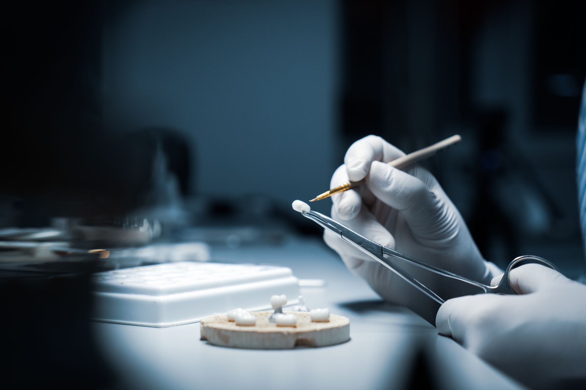Digital dental laboratory technician designing a CAD/CAM restoration. Digital dental laboratory technician designing a CAD/CAM restoration.
