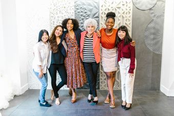 A team of beauty and wellness professionals collaborating and working together in the salon at Luxe Cosmetic Studios