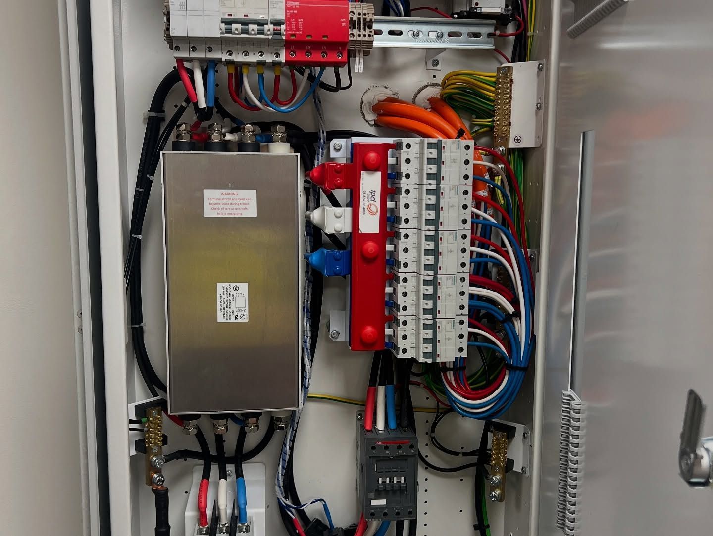 Electrical Panel With Various Wires, Circuit Breakers — Des Mullins Electrical & Solar in Wagga Wagga, NSW