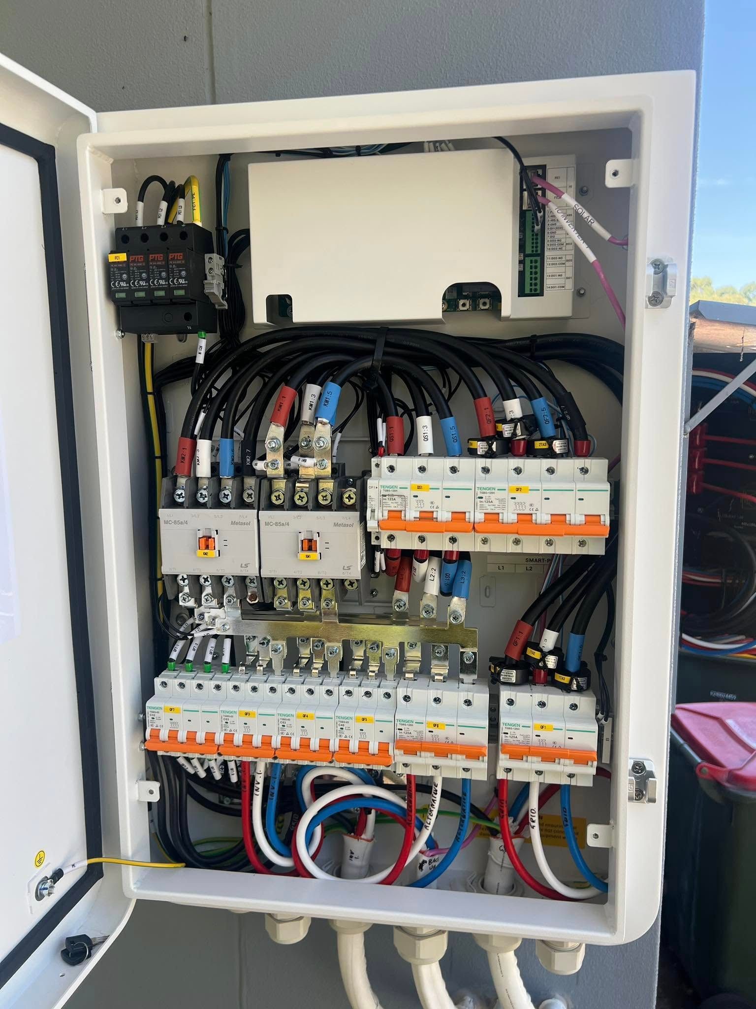 White Electrical Panel With Breakers, Wires — Des Mullins Electrical & Solar in Wagga Wagga, NSW
