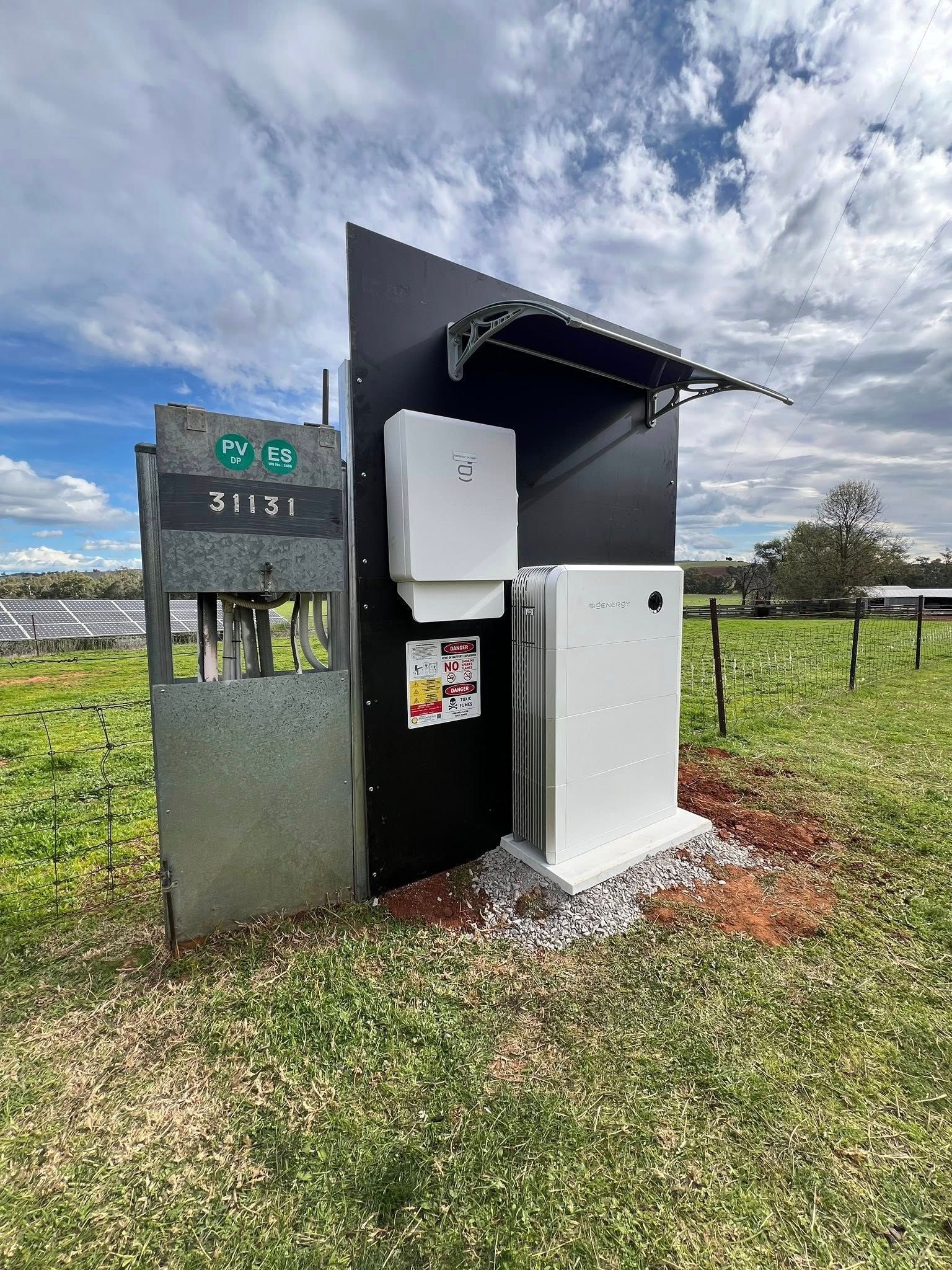 Outdoor Solar Power Equipment on a Grassy Field — Des Mullins Electrical & Solar in Wagga Wagga, NSW