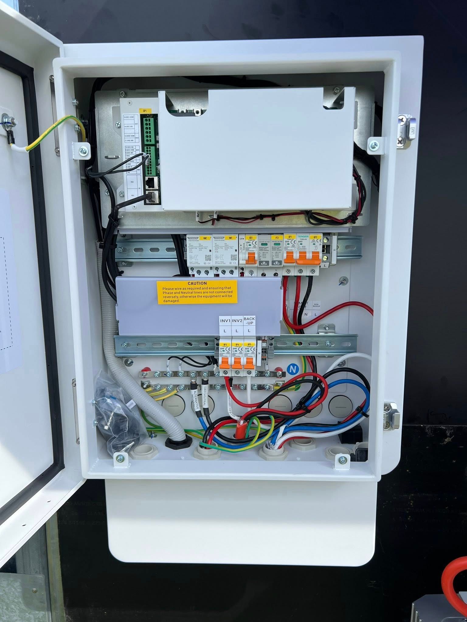 Open White Electrical Box With Wiring, Circuit Breakers — Des Mullins Electrical & Solar in Wagga Wagga, NSW