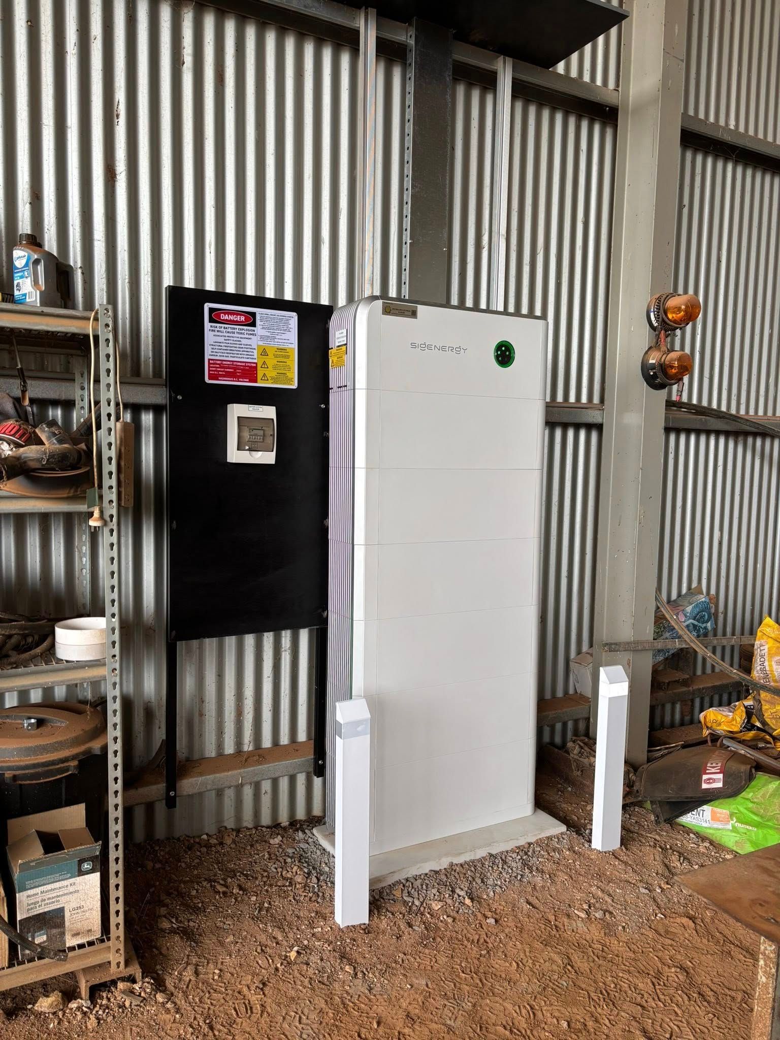 Solar Battery System in a Corrugated Metal Shed — Des Mullins Electrical & Solar in Wagga Wagga, NSW