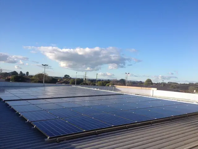 Solar Panels on a Building Rooftop — Des Mullins Electrical & Solar in Wagga Wagga, NSW