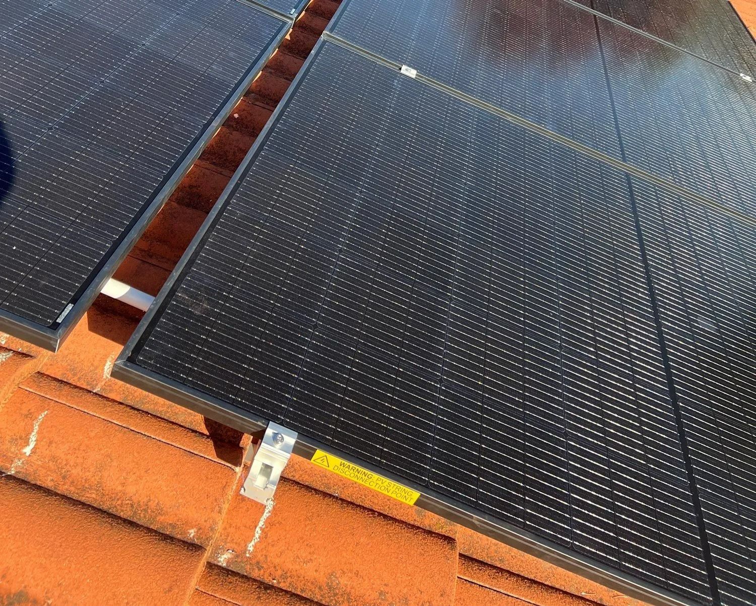 Solar Panels Installed on a Terracotta Tile Roof — Des Mullins Electrical & Solar in Wagga Wagga, NSW Solar Panels Installed on a Terracotta Tile Roof — Des Mullins Electrical & Solar in Wagga Wagga, NSW