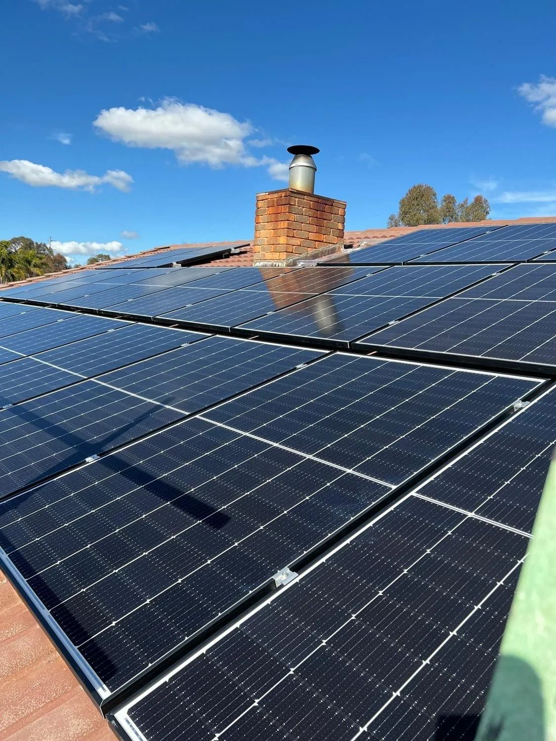 Solar Panels On A The Roof Of A House — Des Mullins Electrical & Solar In Wagga Wagga, NSW Solar Panels On A The Roof Of A House — Des Mullins Electrical & Solar In Wagga Wagga, NSW