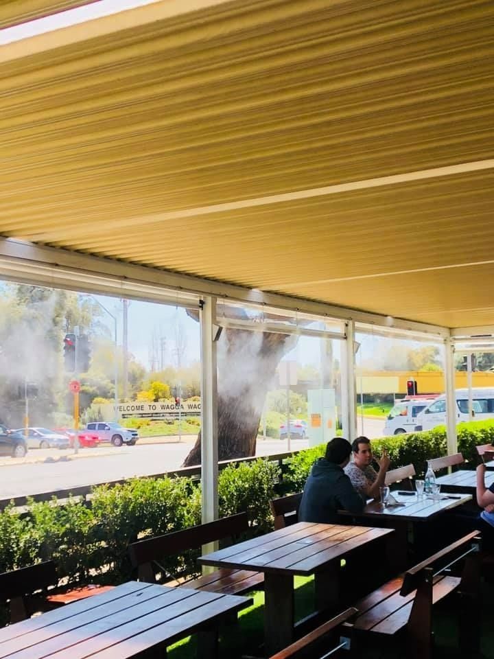 Outdoor Seating Area With Tables — Des Mullins Electrical & Solar in Wagga Wagga, NSW