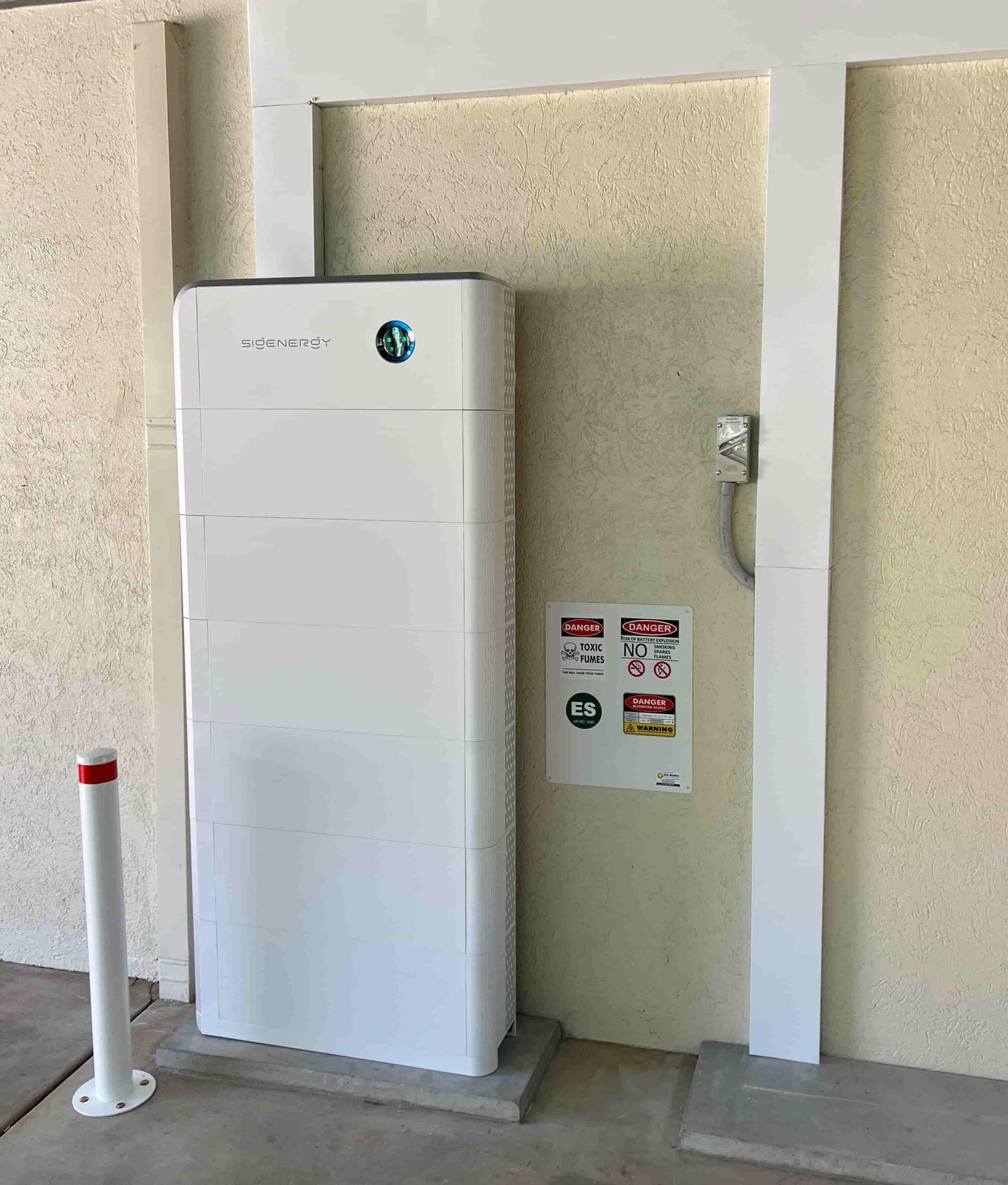 White Energy Storage Unit Mounted on a Concrete Base — Des Mullins Electrical & Solar in Wagga Wagga, NSW