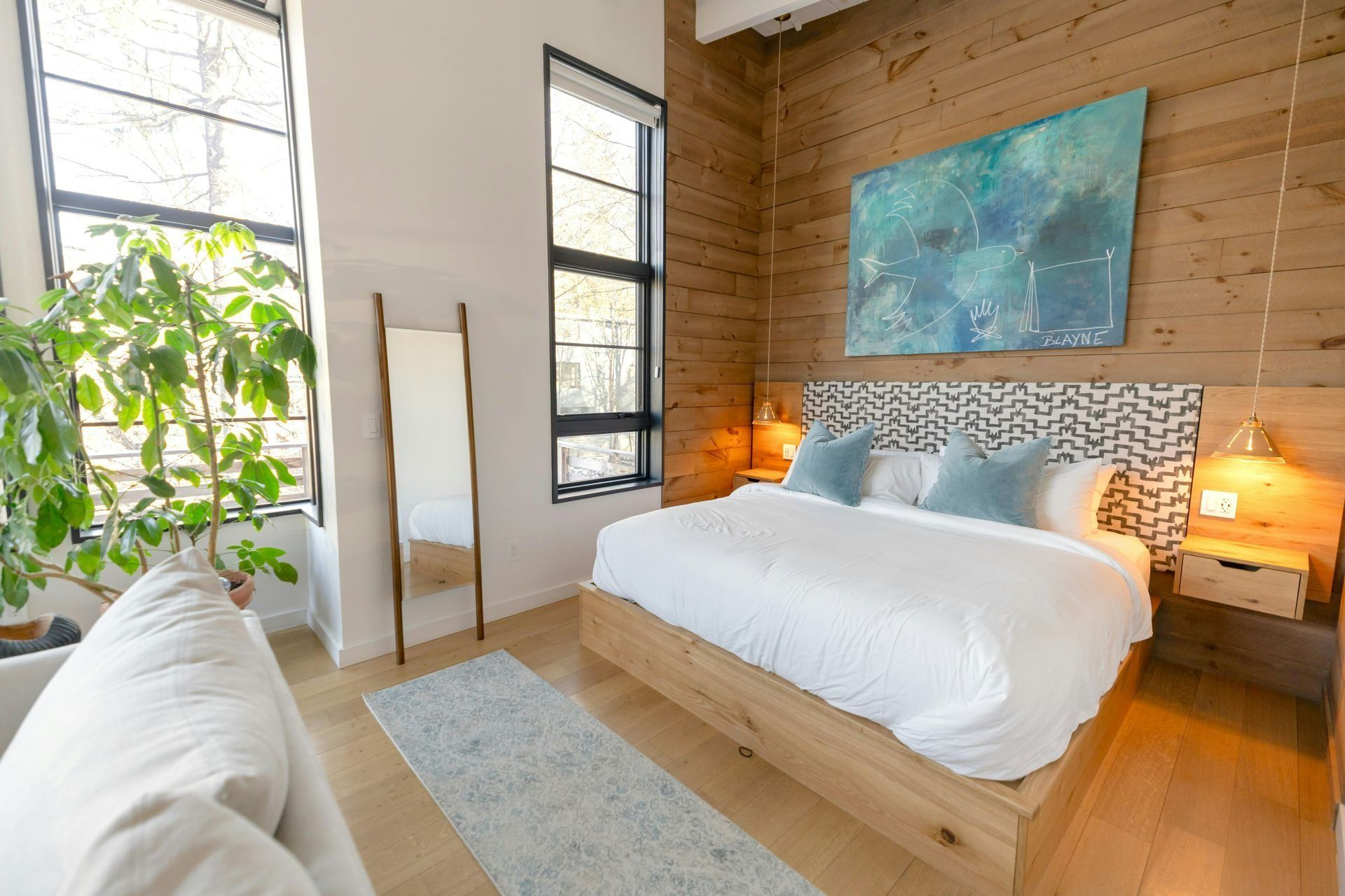 Bedroom With Wood-paneled Wall — Des Mullins Electrical & Solar in Wagga Wagga, NSW