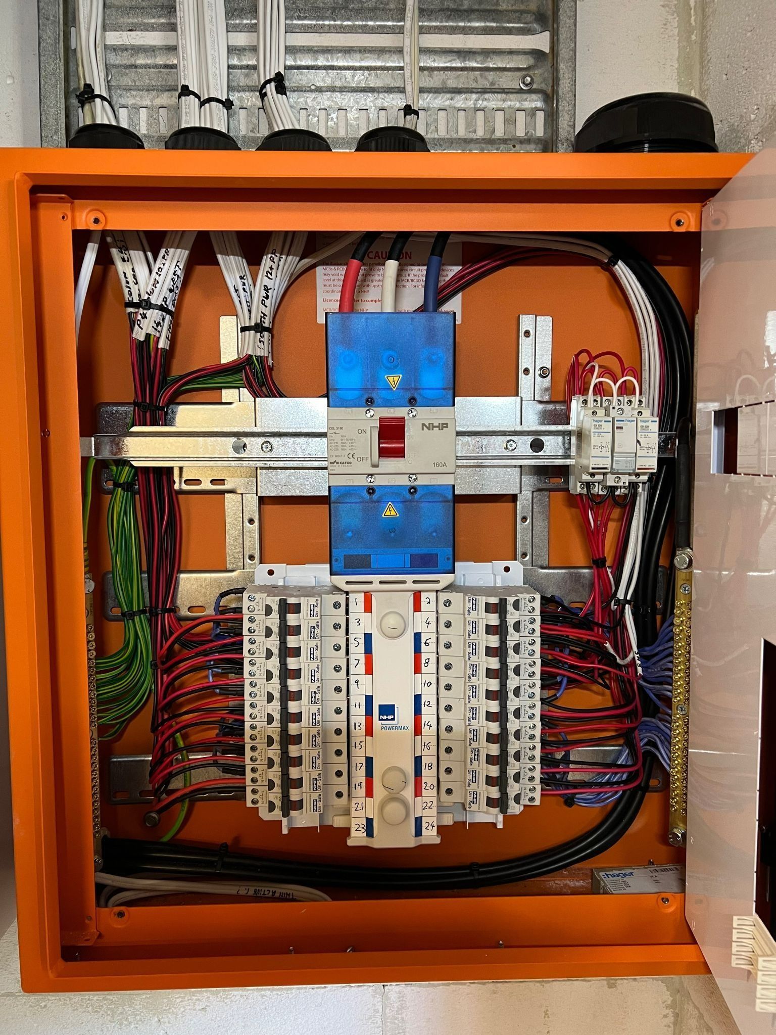 Orange Electrical Panel With Wires — Des Mullins Electrical & Solar in Wagga Wagga, NSW