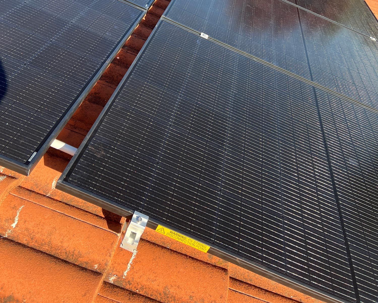 Solar Panels Carefully Installed On The Roof — Des Mullins Electrical & Solar In Wagga Wagga, NSW