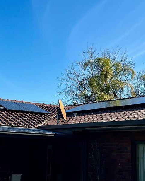 Solar Panels and Satellite Dish on a Tile Roof — Des Mullins Electrical & Solar in Wagga Wagga, NSW