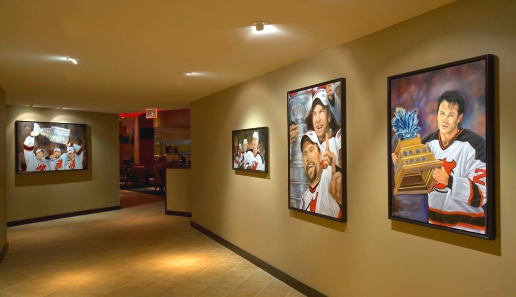 Hallway with large framed artwork of basketball players.