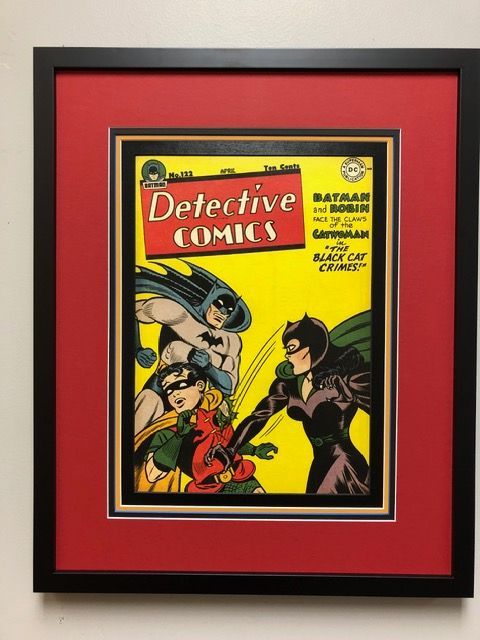 Framed vintage Detective Comics cover with Batman and Robin on a red mat background