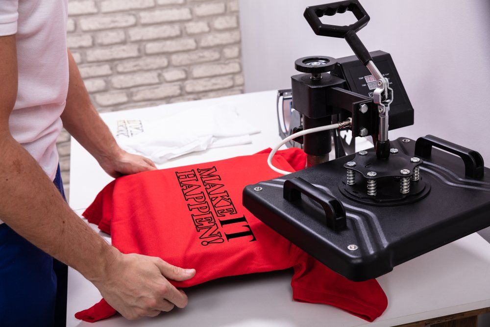 Man Printing On T Shirt In Workshop — Screen Printing In Lismore, NSW