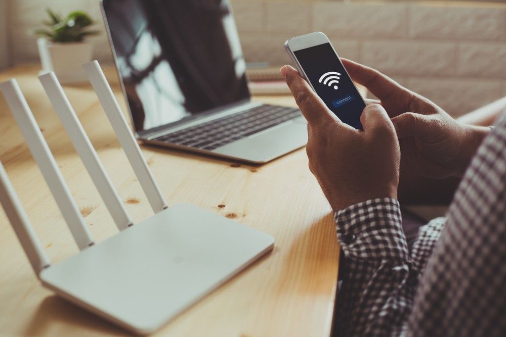 A Person Holding a Smartphone Connected to A Wi-Fi Network — Oz Data Tech in Taree, NSW