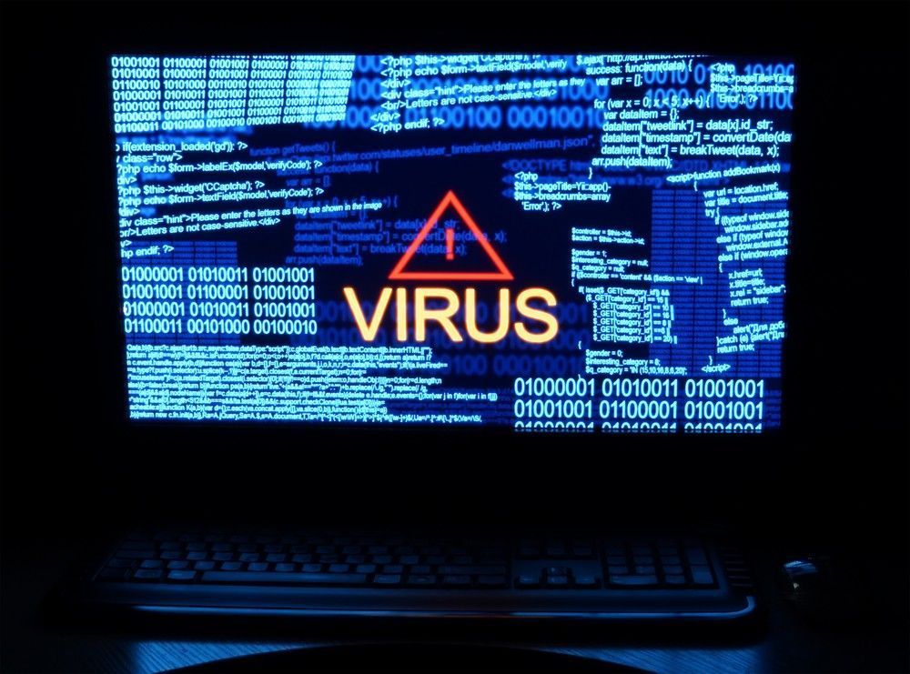 Computer Screen Displaying Binary Code with A Virus Warning — Oz Data Tech in Taree, NSW