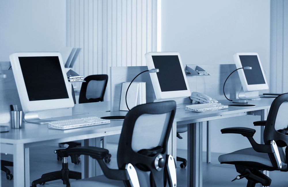 A Row Of Desks With Computers And Chairs In An Office β Oz Data Tech in Forster, NSW