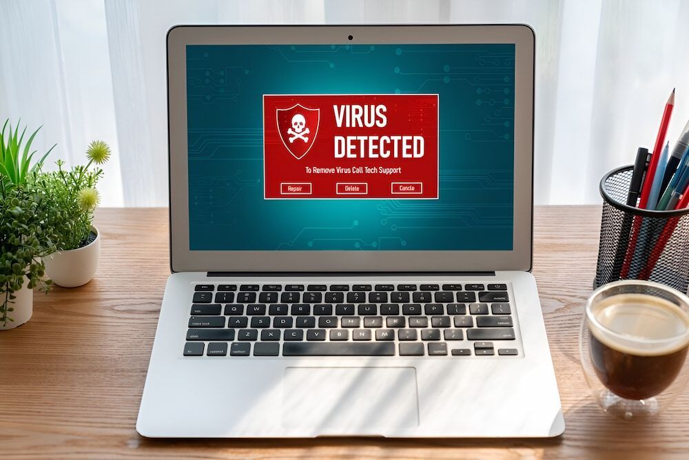 A Laptop Computer Is Open To A Screen That Says Virus Detected β Oz Data Tech in Forster, NSW