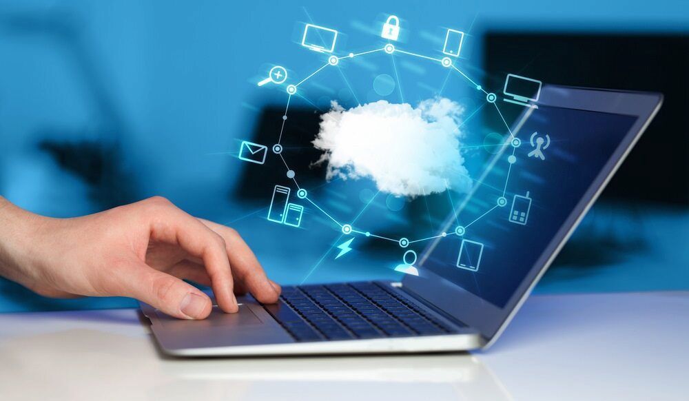 A Person Is Typing On A Laptop Computer With A Cloud Coming Out Of The Screen β Oz Data Tech in Forster, NSW