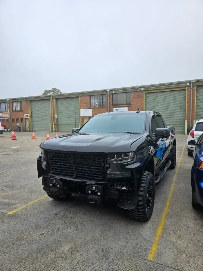 Black ute undergoing smash repair at Modified Smash Repairs Warwick Farm NSW