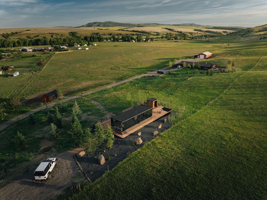 Golden Ranch Montana airbnb mirror cabin and main house drone shot