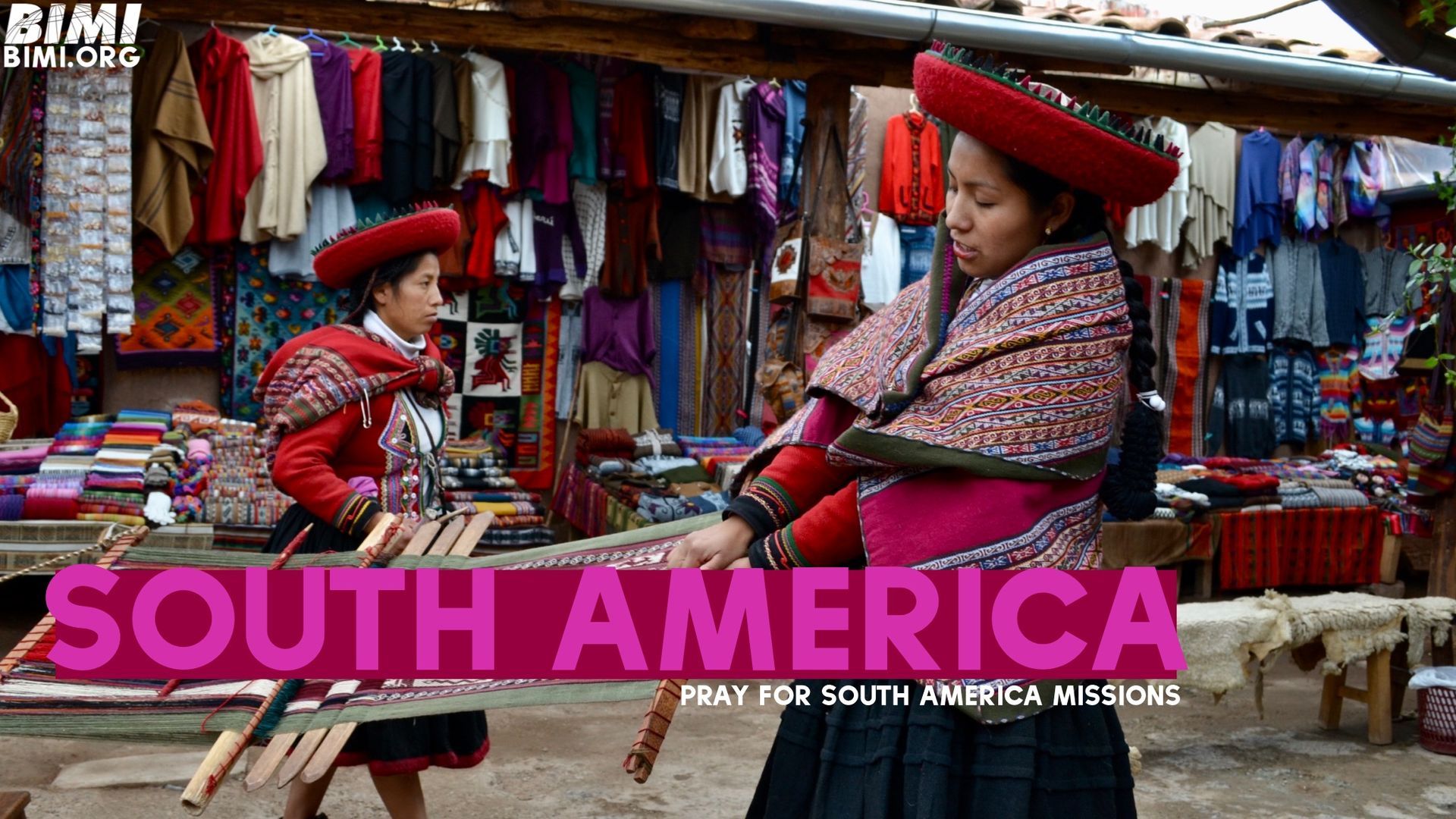 Two women in traditional Peruvian clothing near textiles; 
