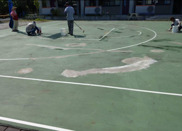 Old basketball court with faded paint and worn patches showing damage before renovation during a court installation service in Chandler, AZ
