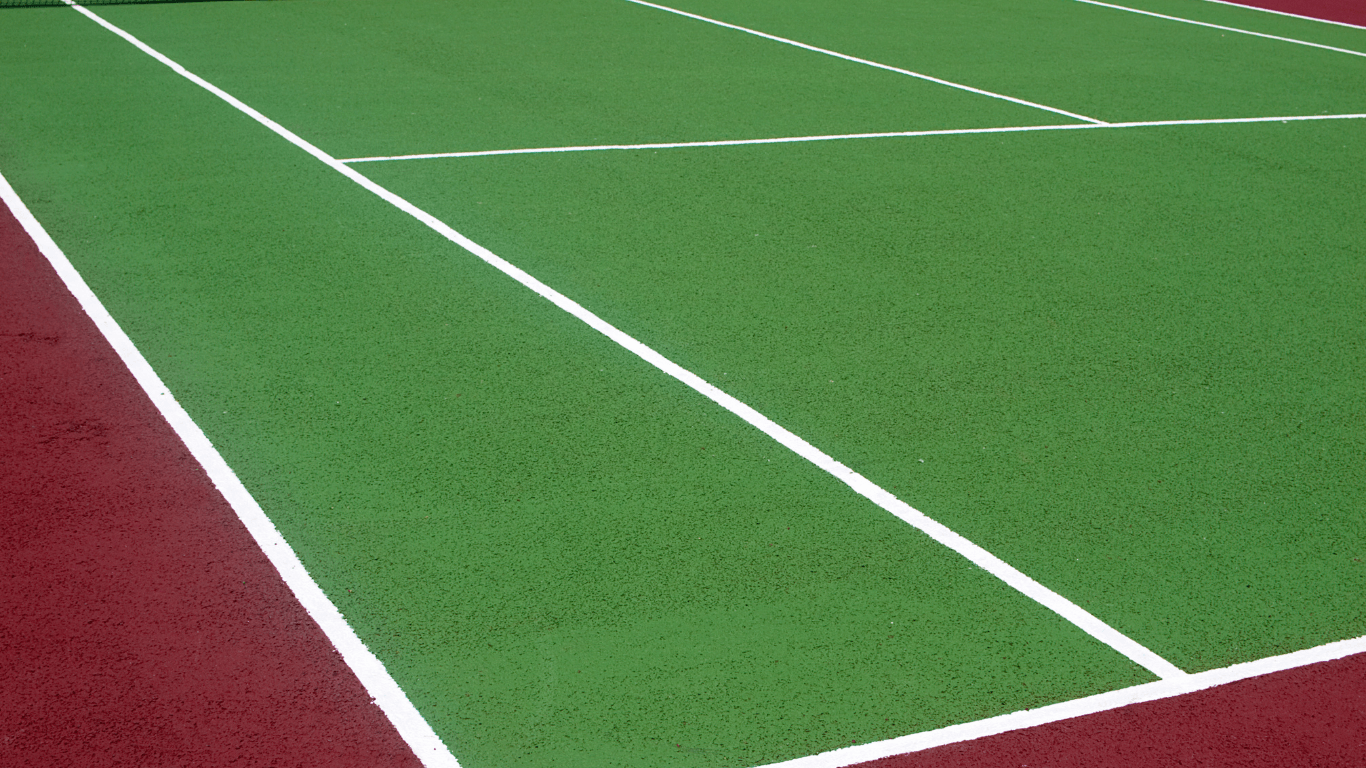 Close-up of green sport court surface with sharp white lines and textured finish from a court installation service in Chandler, AZ