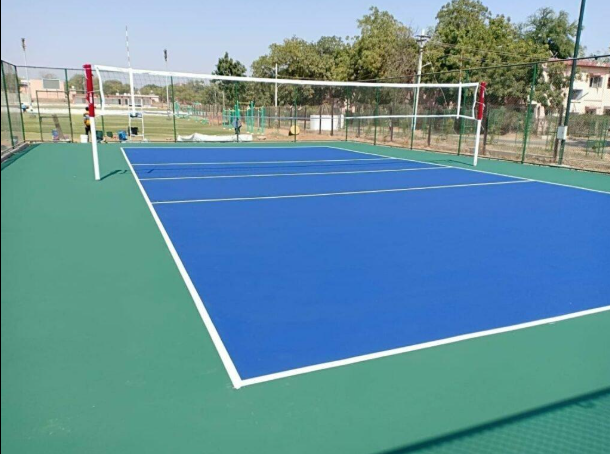 Clean outdoor sport court with blue playing surface and green borders ready for use after a court installation service in Chandler, AZ