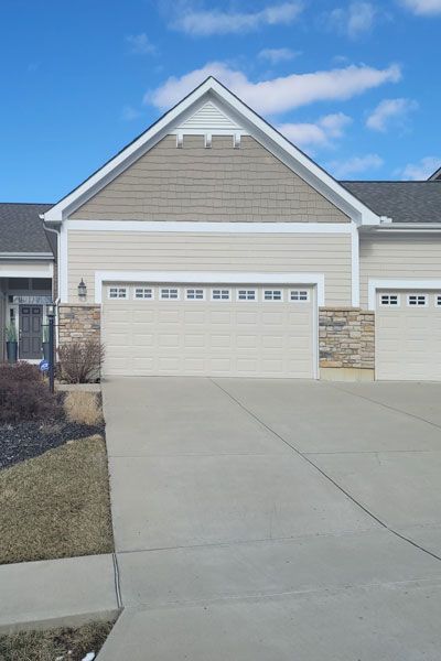 Tan house exterior completed by Allstate Exterior in Columbus, OH