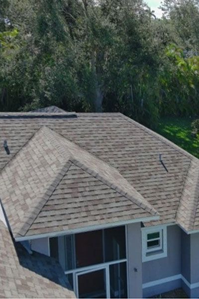 An aerial view of a house with a large roof