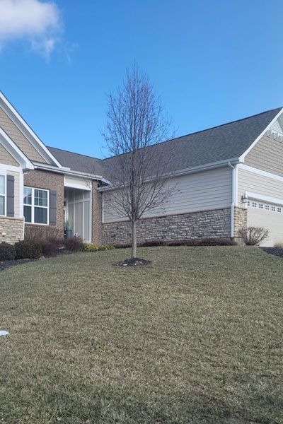 Frontyard view of a tan home in Springfield, OH
