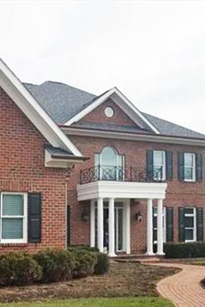 New shingle roof on a brick home with many gables