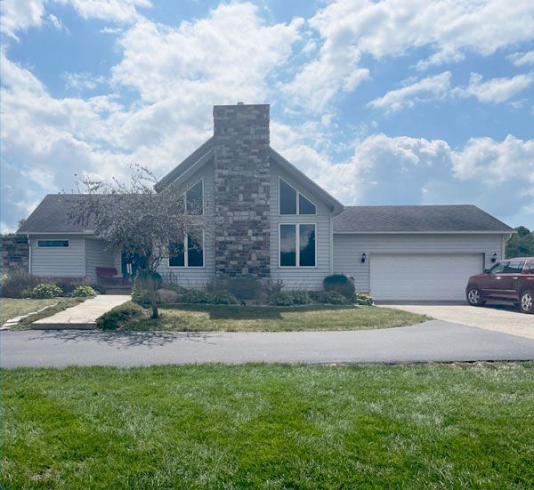 Post modern home with new roof