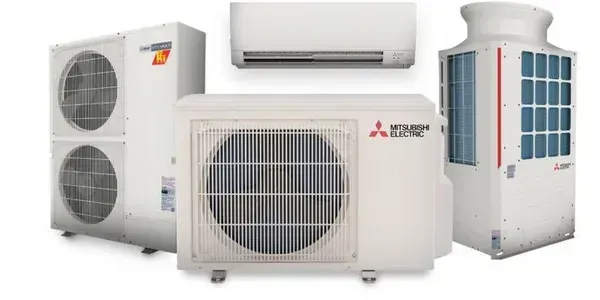 A group of air conditioners are sitting next to each other on a white background.