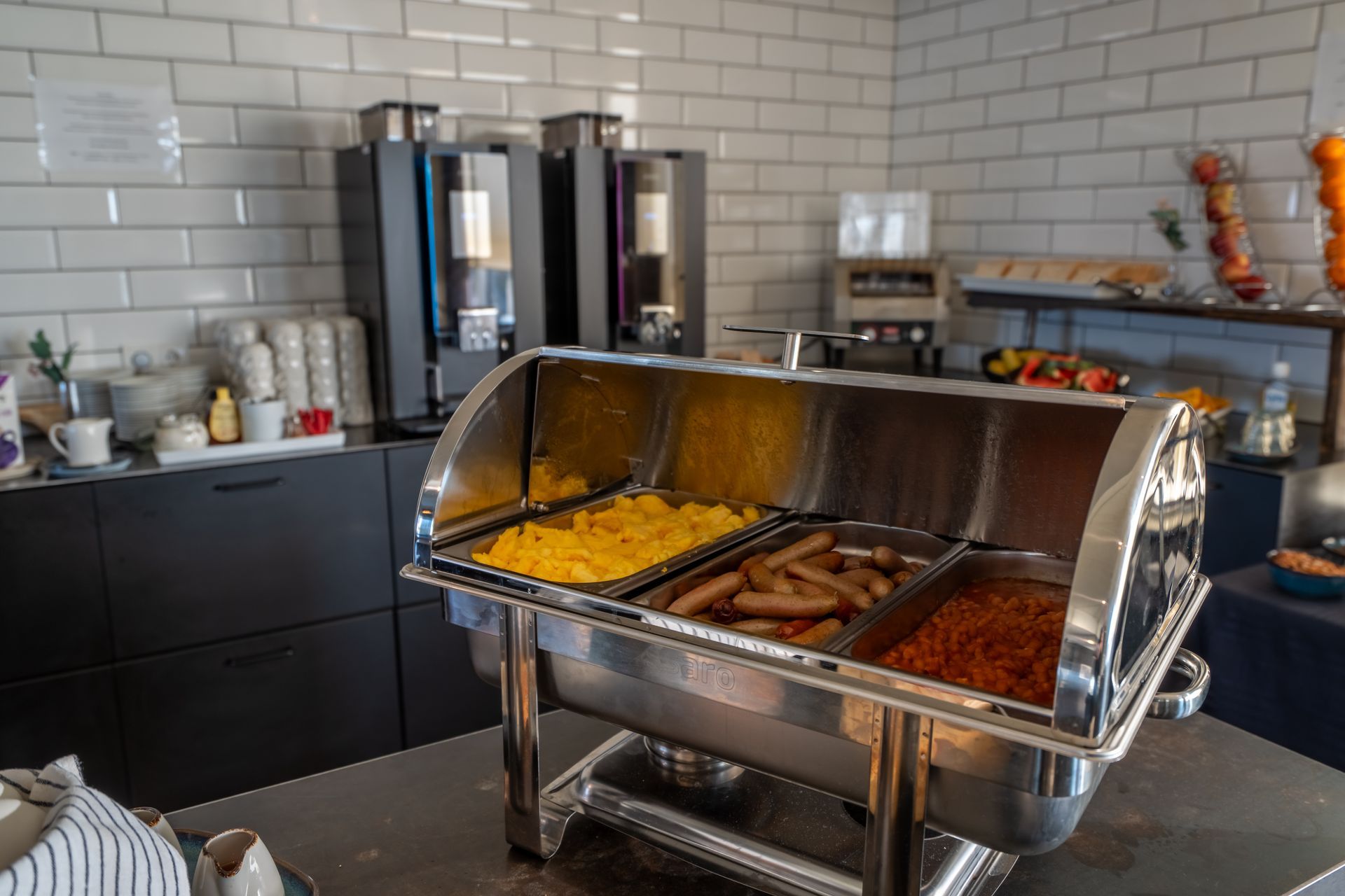 There is a buffet with a variety of food on it.