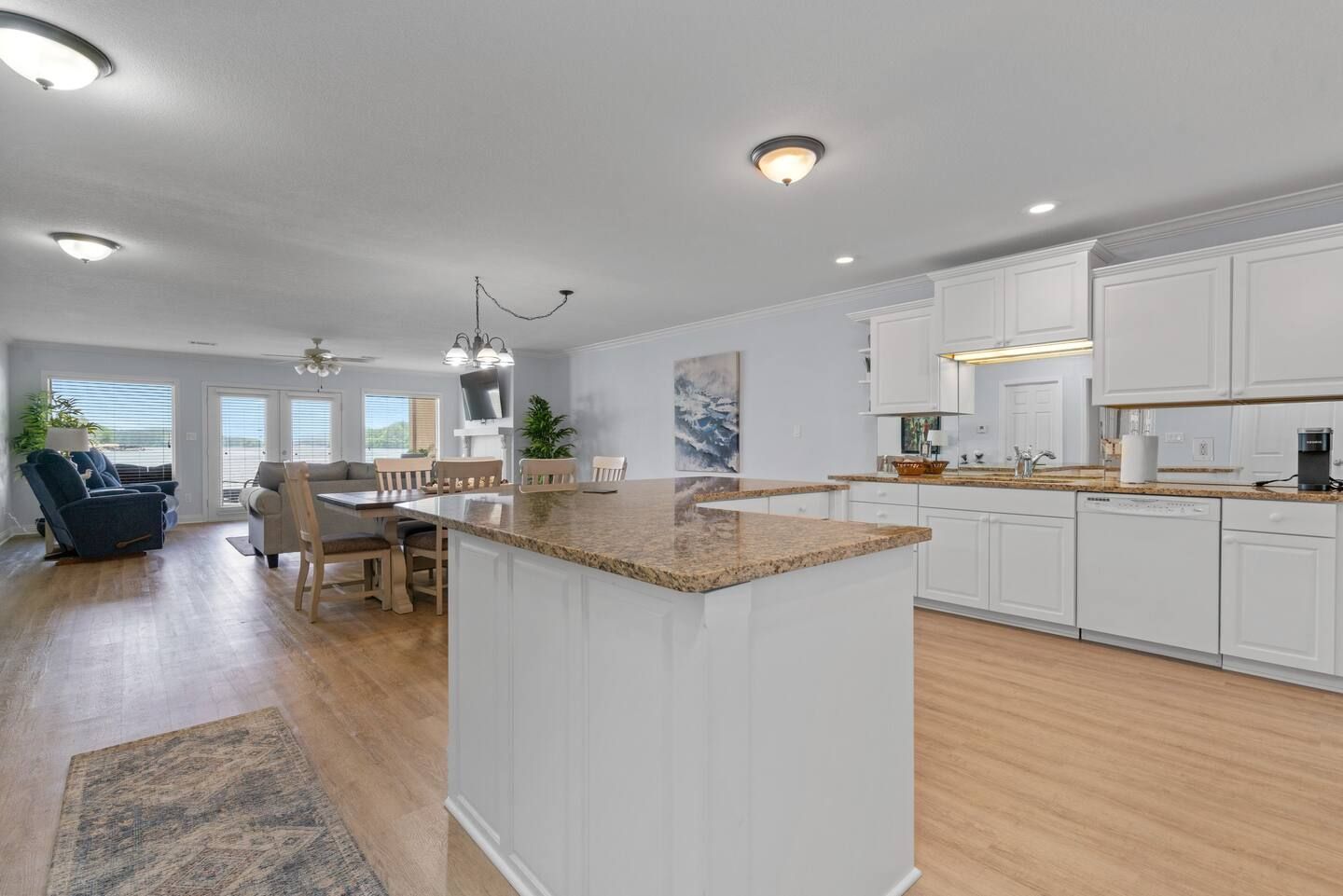 A kitchen with a large island in the middle of the room.