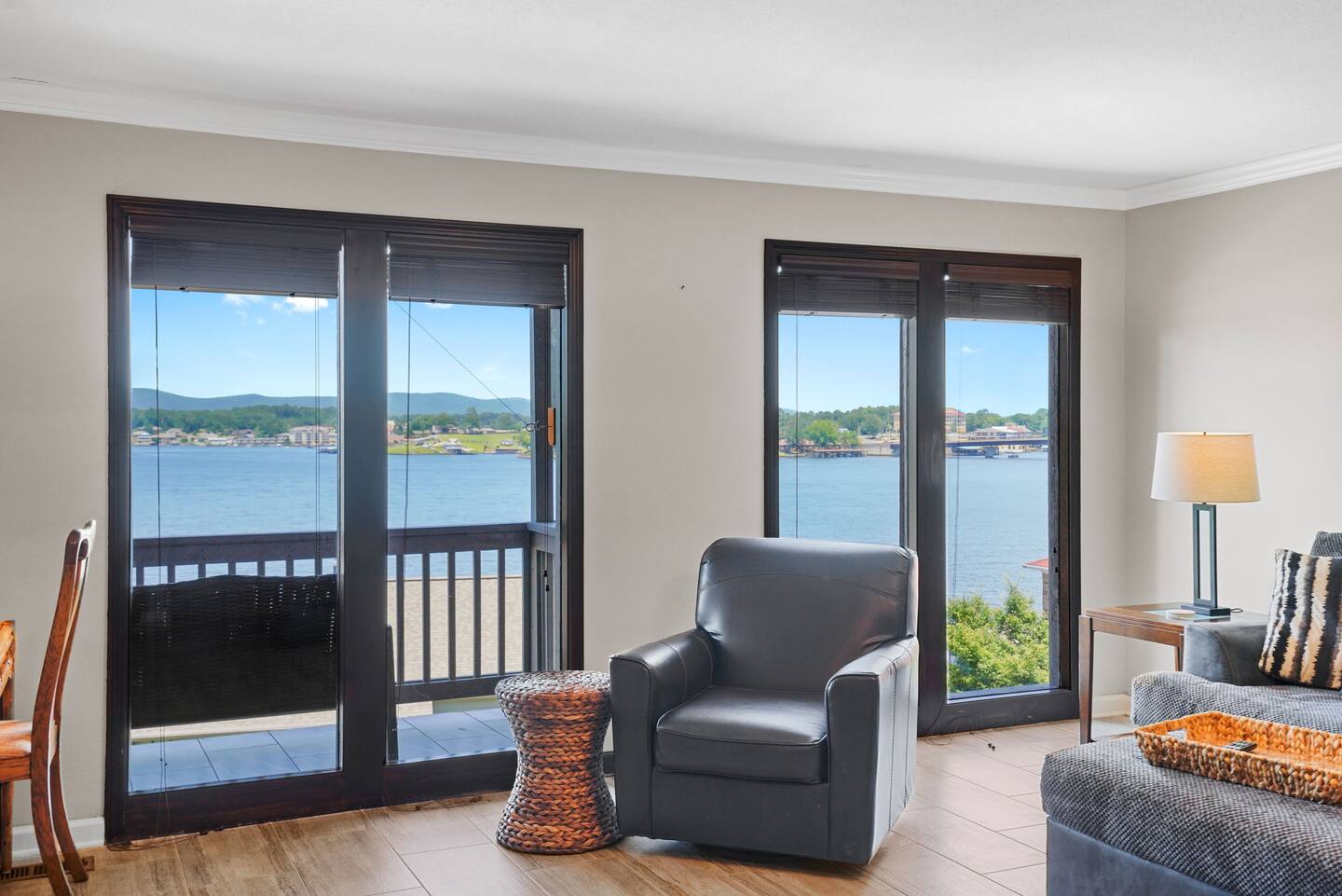 A living room with a view of a lake.