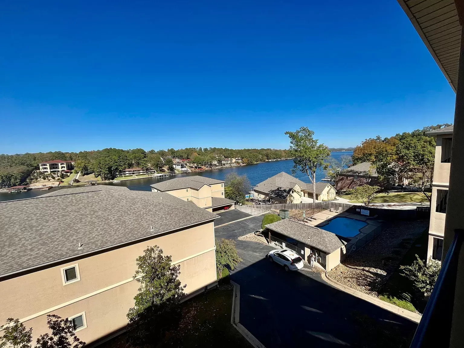 A view of a lake from a balcony of a building