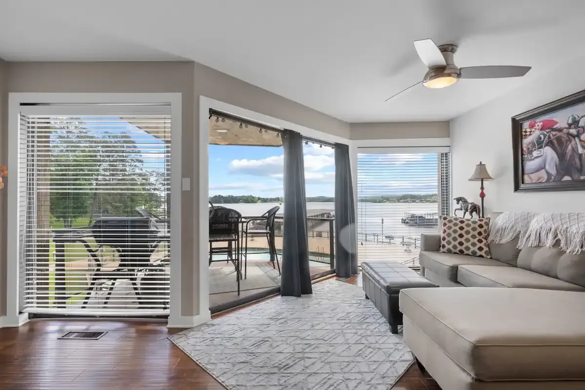 A living room with a couch and a ceiling fan